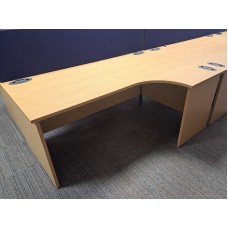 Light oak 1800mm by 1200mm radial desks with matching mobile pedestals